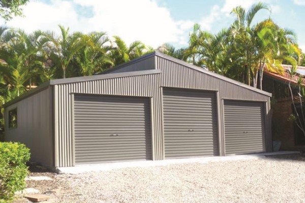 Brown triple garage with a skillion roof and a lean to