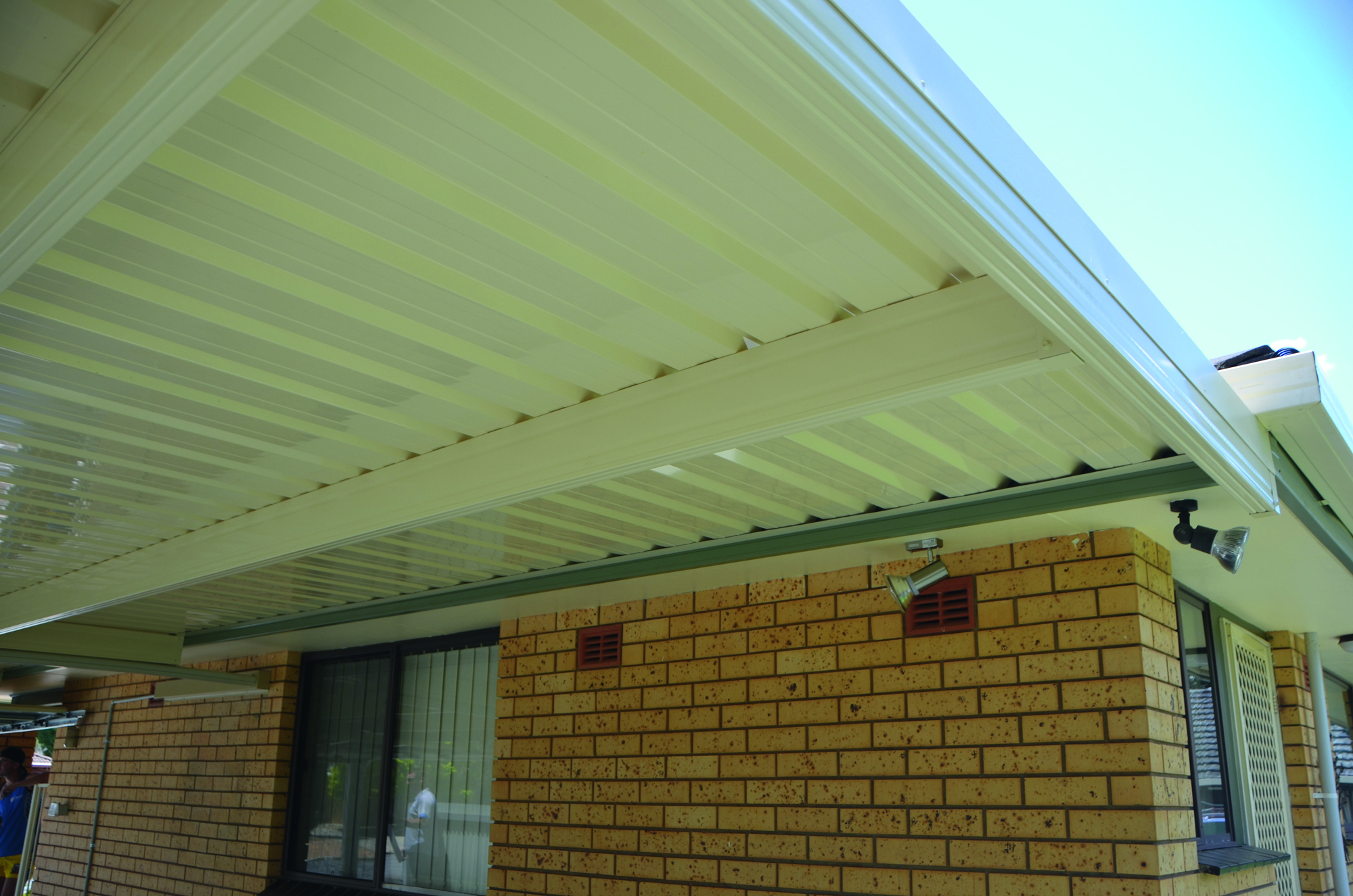 Underside of a patio roof showing backing channel