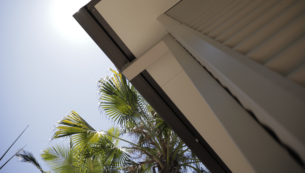 Shot of the underside of eaves showing the downpipes and gutters