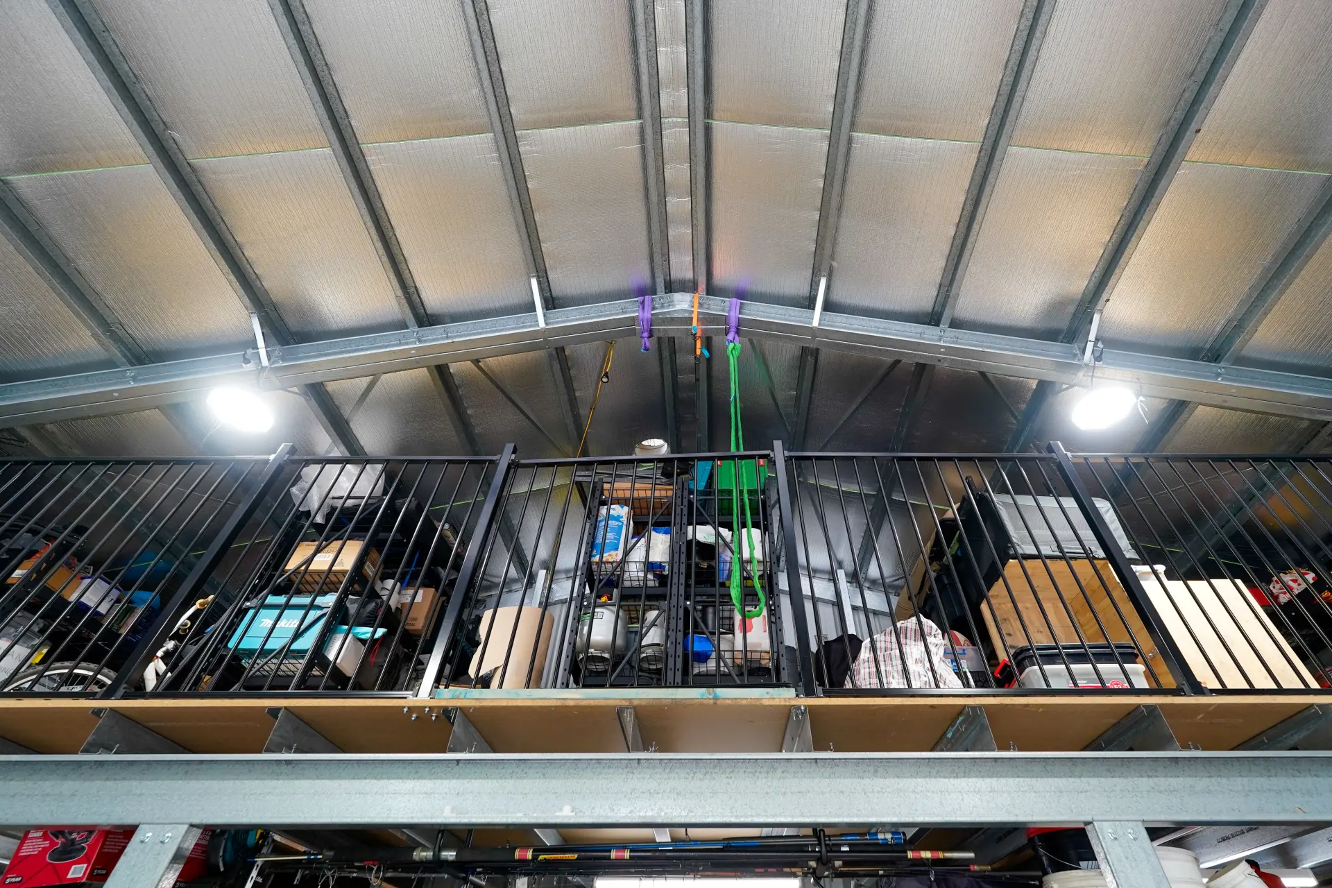 Mezzanine storage inside workshop shed