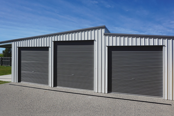 Skillion roof shed with lean-to and three roller doors