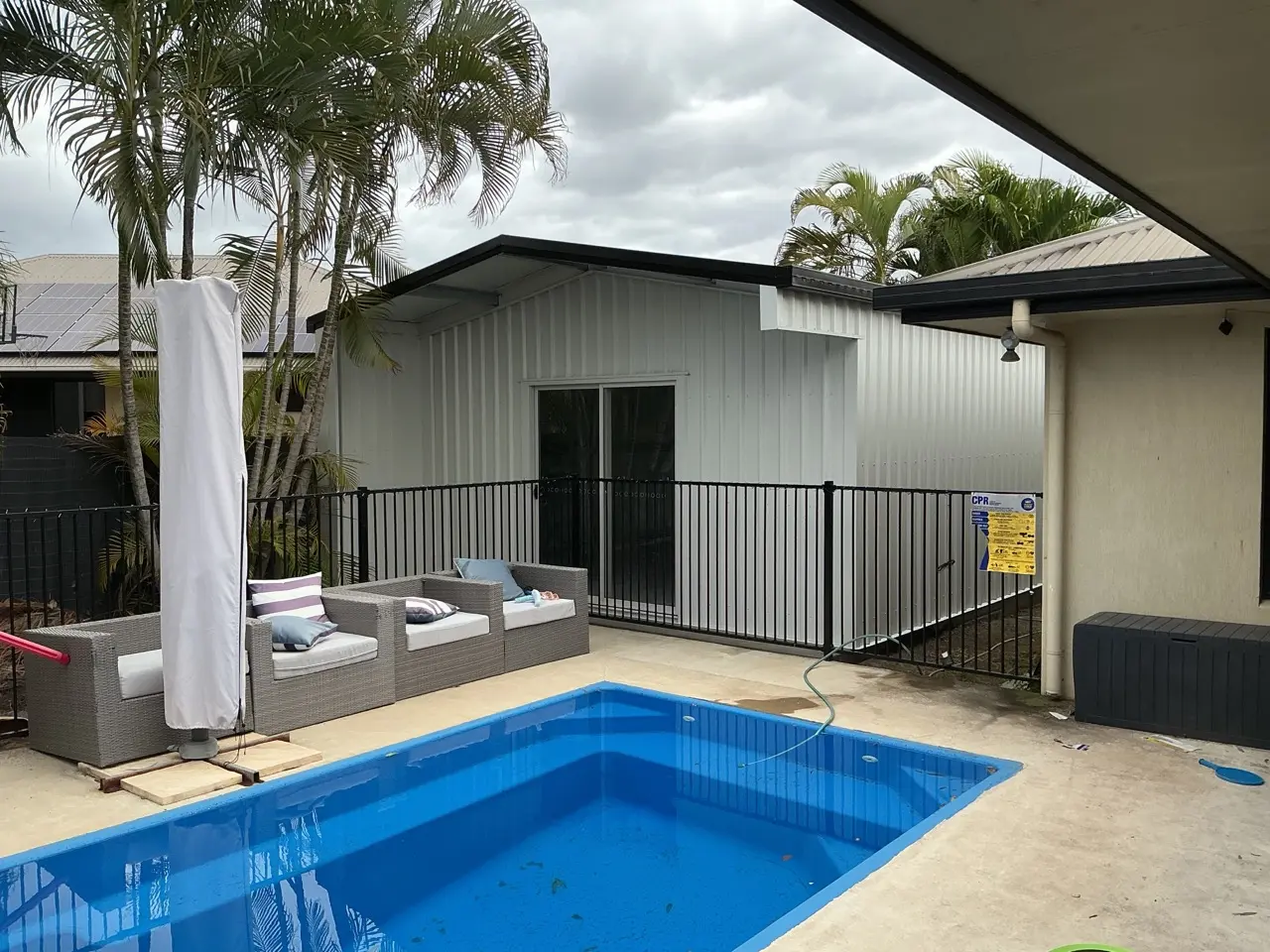 Backyard shed with sliding glass door