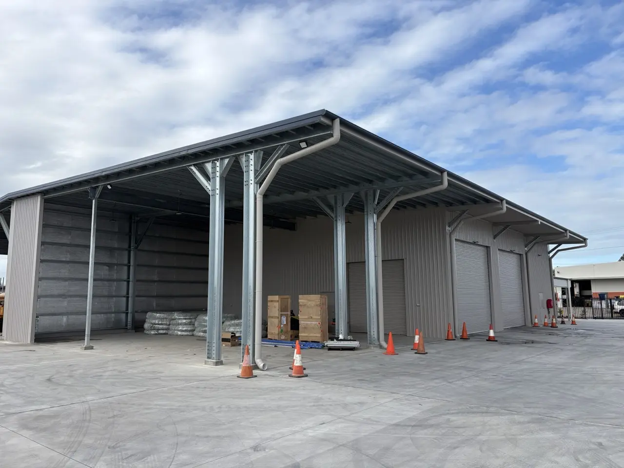 Industrial shed with awning and roller doors
