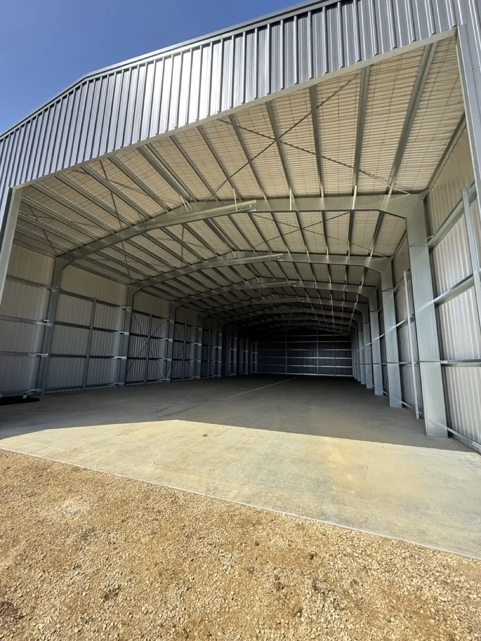 Interior of large open front industrial shed