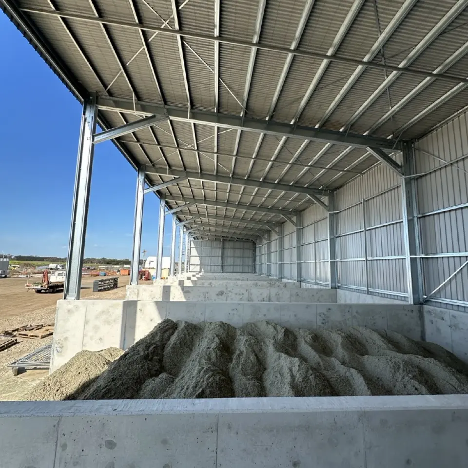 Interior of commercial shed with concrete bunker bays